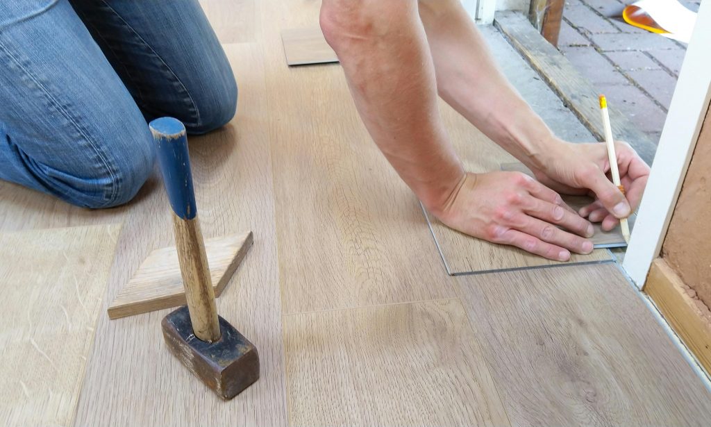 floor-flooring-hand-man-1388944-1388944-1 Person Holding Pencil